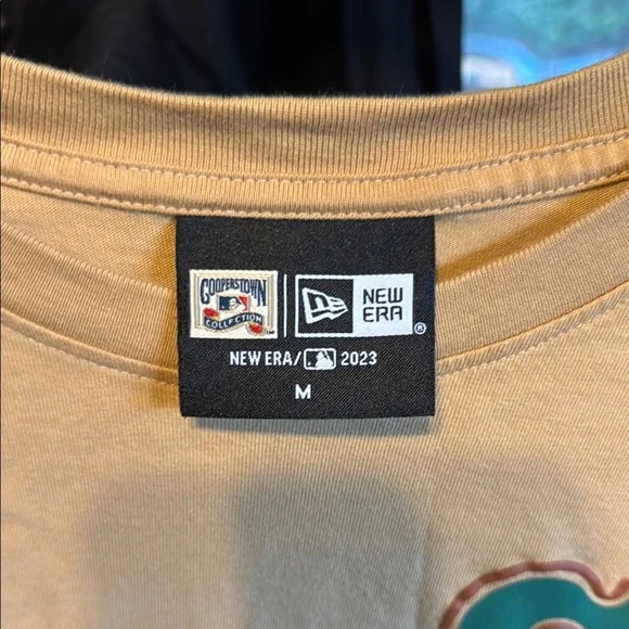 Tan Long Sleeve Shirt with Green S Logo - Picture 2 of 3